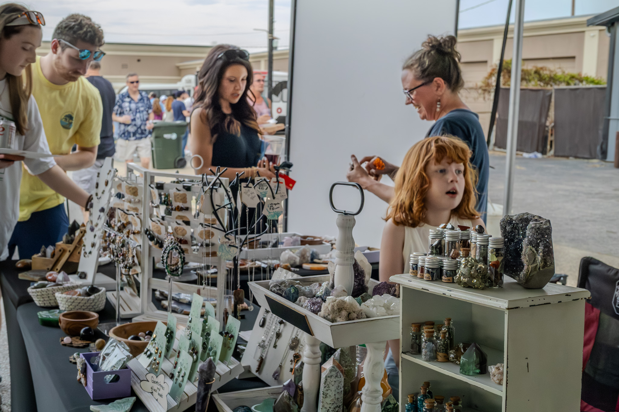 Vendor booth featuring customized wire-wrapped pieces